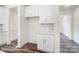 Mudroom featuring white cabinets, subway tile backsplash, and washer/dryer hookups at 2233 Tabor Rd # 586, Sherrills Ford, NC 28673