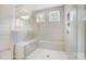 Modern bathroom featuring large tiled shower with glass enclosure, bench, and recessed shelving at 2233 Tabor Rd # 586, Sherrills Ford, NC 28673