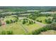 Expansive aerial view of property with mature trees, green fields, and multiple buildings on a sunny day at 2448 Moss Farm Rd, Hickory, NC 28602