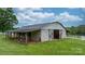 Well-maintained barn with a sturdy structure, open doors, and ample space for livestock or storage at 2448 Moss Farm Rd, Hickory, NC 28602