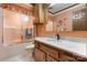 Well-maintained bathroom with marble countertops, wooden cabinets, and a shower-tub combination at 2448 Moss Farm Rd, Hickory, NC 28602