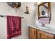 Bathroom with vanity, decorative accents, and adequate towel storage at 2448 Moss Farm Rd, Hickory, NC 28602