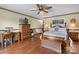 Spacious bedroom with hardwood floors, a ceiling fan, and traditional furniture at 2448 Moss Farm Rd, Hickory, NC 28602