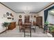 Dining room featuring chandelier, carpet, natural light, traditional decor, and traditional wood furniture at 2448 Moss Farm Rd, Hickory, NC 28602