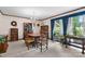 Bright dining room with carpet, traditional decor, chandelier, and large window with natural light at 2448 Moss Farm Rd, Hickory, NC 28602