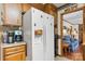 Kitchen featuring white refrigerator, adjacent to coffee station, built in oven, with wood cabinets and countertops at 2448 Moss Farm Rd, Hickory, NC 28602