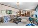 Spacious living room showcasing carpet, traditional décor, with sofa and large center table at 2448 Moss Farm Rd, Hickory, NC 28602