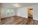 Bright bedroom features hardwood floors, a window and a doorway to a bathroom at 24515 Saint Martin Rd, Albemarle, NC 28001