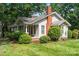 Charming single-Gathering home with a well-manicured front yard and inviting curb appeal at 24515 Saint Martin Rd, Albemarle, NC 28001