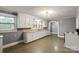 Well-lit kitchen features ample counter space, white cabinets, and vintage stove at 24515 Saint Martin Rd, Albemarle, NC 28001