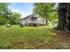 View of the home's front yard and tree with the home in the background at 24515 Saint Martin Rd, Albemarle, NC 28001