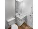 Bathroom featuring a white vanity, toilet, and modern chrome hardware at 2532 Steeplechase Rd, Gastonia, NC 28056