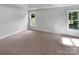 Bright bedroom with neutral carpet, paint and plenty of natural light from multiple windows at 2532 Steeplechase Rd, Gastonia, NC 28056