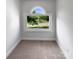 Well-lit bedroom with neutral carpet and window offering views of the exterior at 2532 Steeplechase Rd, Gastonia, NC 28056