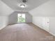 Large bedroom with neutral carpet, bright light, and closet perfect for storage at 2532 Steeplechase Rd, Gastonia, NC 28056