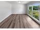 Bright, unfurnished bedroom with hardwood flooring and a large window with pleasant views at 2532 Steeplechase Rd, Gastonia, NC 28056