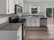 Well-lit kitchen showcases stainless appliances, granite countertops, and ample cabinet space at 2532 Steeplechase Rd, Gastonia, NC 28056