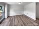 Bright living room features wood-look flooring and fresh neutral paint, awaiting your personal touch at 2532 Steeplechase Rd, Gastonia, NC 28056