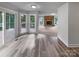 Open-concept living area with fireplace and bright natural light, plus access to outdoor deck at 2532 Steeplechase Rd, Gastonia, NC 28056