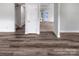 Unfurnished living room area showcasing hardwood flooring and neutral walls at 2532 Steeplechase Rd, Gastonia, NC 28056