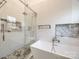 Elegant bathroom showcases a glass shower, a soaking tub, and stylish tiling at 2702 Oxborough Dr, Matthews, NC 28105