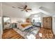 Attic bedroom with a desk and a bright window; wood floors provide a rustic touch at 2702 Oxborough Dr, Matthews, NC 28105