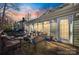 Inviting deck with outdoor seating, a fire pit, and a colorful sunset at 2702 Oxborough Dr, Matthews, NC 28105