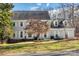 Charming two-story home with a well-manicured lawn, gray siding, white shutters and dormer windows at 2702 Oxborough Dr, Matthews, NC 28105