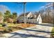 Well-maintained two-story home featuring an attached garage and spacious driveway, surrounded by mature trees at 2702 Oxborough Dr, Matthews, NC 28105