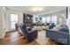 Cozy living room with plush seating, fireplace, mounted TV, and soft lighting for a relaxing ambiance at 2702 Oxborough Dr, Matthews, NC 28105