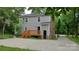 Back exterior featuring a newly stained deck and sport court offering space for outdoor enjoyment and activities at 2716 Rea Rd, Charlotte, NC 28226