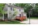 Backyard view featuring a newly stained deck and sport court, perfect for outdoor enjoyment and recreation at 2716 Rea Rd, Charlotte, NC 28226