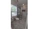 Renovated bathroom featuring a glass shower, new toilet, and gray floors at 2716 Rea Rd, Charlotte, NC 28226