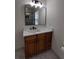 Remodeled bathroom with a wood vanity and a quartz countertop at 2716 Rea Rd, Charlotte, NC 28226