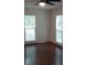 Bedroom features hardwood floors, natural light, and a ceiling fan at 2716 Rea Rd, Charlotte, NC 28226