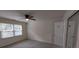 Bedroom featuring natural light, neutral-toned walls, ceiling fan, and a closet with mirrored doors at 2716 Rea Rd, Charlotte, NC 28226