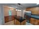 Kitchen with an island, stainless steel refrigerator, and a view into the dining room at 2716 Rea Rd, Charlotte, NC 28226