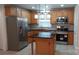 Updated kitchen with stainless steel appliances, a tile backsplash, and a kitchen island at 2716 Rea Rd, Charlotte, NC 28226