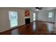 Living room featuring hardwood floors and a fireplace with a modern design at 2716 Rea Rd, Charlotte, NC 28226