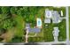 Bird's eye view of property showcasing backyard swimming pool, trampoline, and wooded surroundings at 2968 Grace St, Claremont, NC 28610