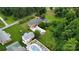 Aerial view of home with backyard inground pool, patio and mature trees at 2968 Grace St, Claremont, NC 28610