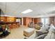 Spacious basement featuring a retro bar area, comfortable seating, and stylish décor, ideal for entertaining guests at 2968 Grace St, Claremont, NC 28610
