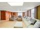 Large basement with paneled walls, tiled floor, and comfortable seating, creating a cozy and inviting space at 2968 Grace St, Claremont, NC 28610