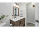 Charming bathroom with wood vanity and white countertop at 2968 Grace St, Claremont, NC 28610