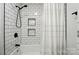 Bathroom with white tile and updated shower head at 2968 Grace St, Claremont, NC 28610