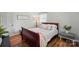 Cozy bedroom with hardwood floors and a small side table at 2968 Grace St, Claremont, NC 28610