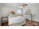 Bedroom with wood floors, dresser with mirror, and ceiling fan at 2968 Grace St, Claremont, NC 28610