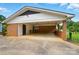 Open carport with brick columns and white trim for covered parking at 2968 Grace St, Claremont, NC 28610