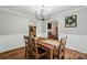 Bright dining room featuring wood floors, table with seating for four, and natural light at 2968 Grace St, Claremont, NC 28610