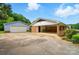 Exterior shot shows carport attached to a storage garage and home at 2968 Grace St, Claremont, NC 28610